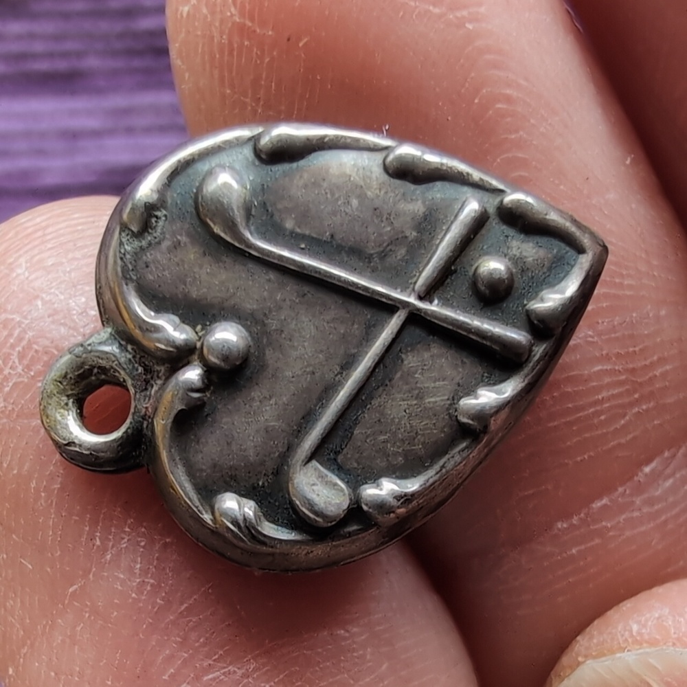 Antique sterling silver puffed heart charm